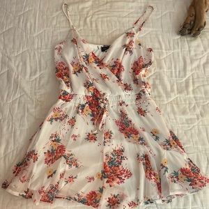 Francesca’s White and Floral Strappy Romper